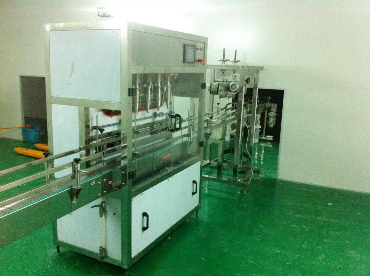 Linear filling machine with 4 filling heads LINEAR FILLING MACHINE.jpg
